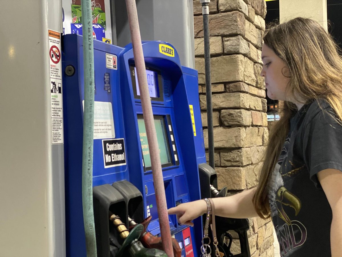 USM student Julie Mclain fills up at a local gas station.