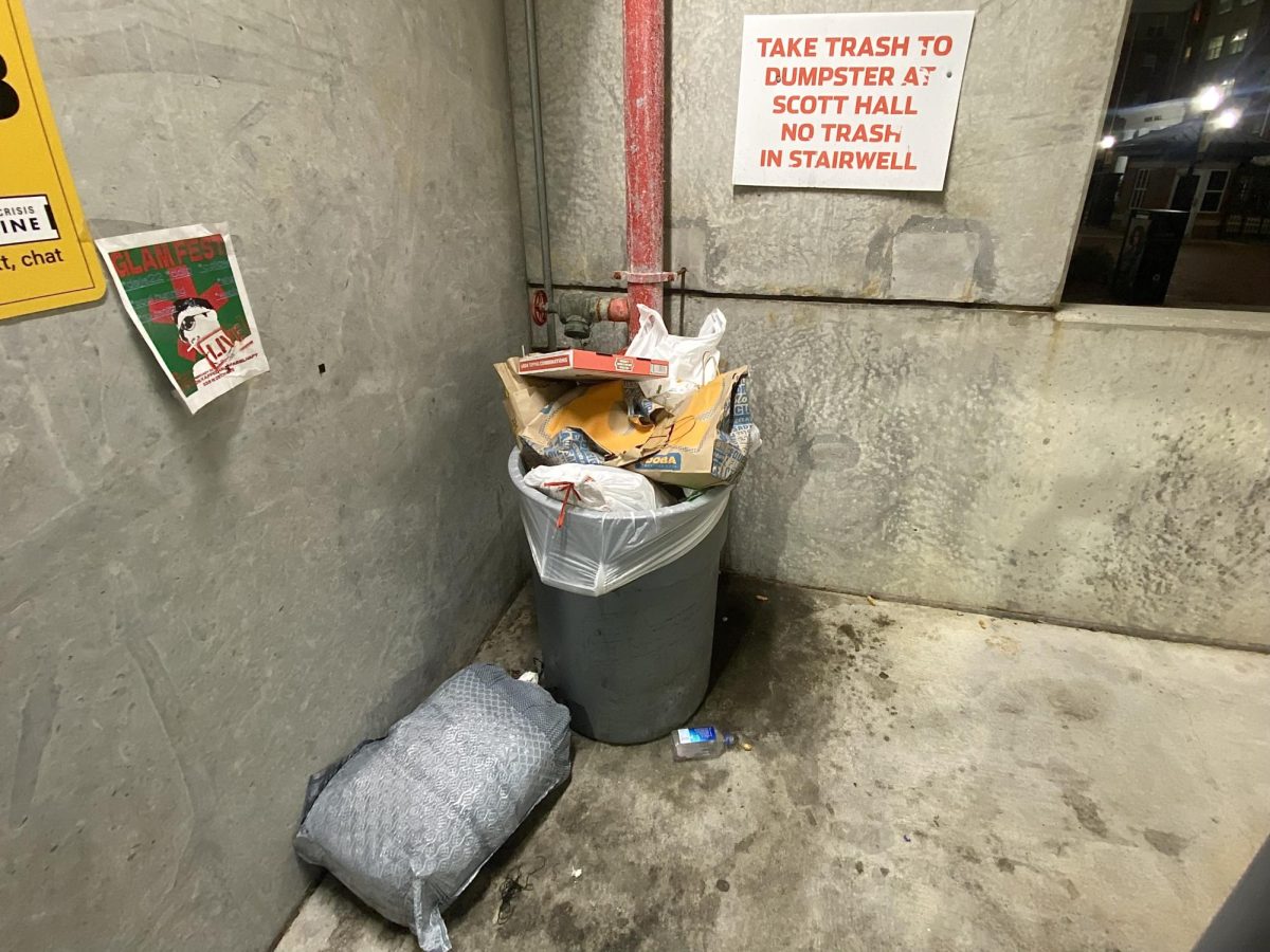 A full trash bin inside the USM parking garage.