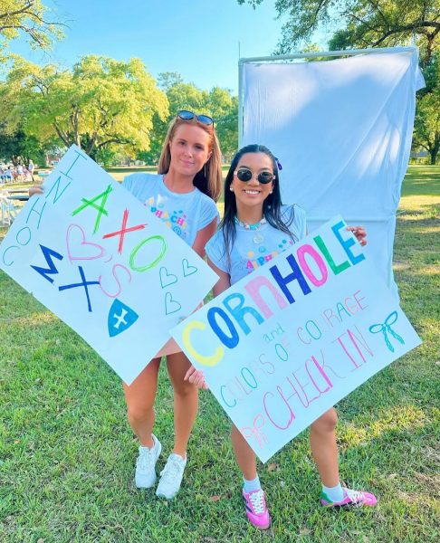 Alpha Chi Omega members cheer on competing teams.