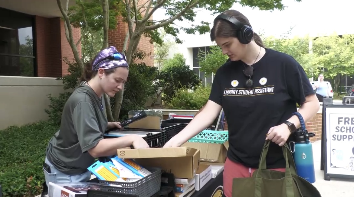 USM students partake in the Office of Sustainability's event giving out free school supplies.