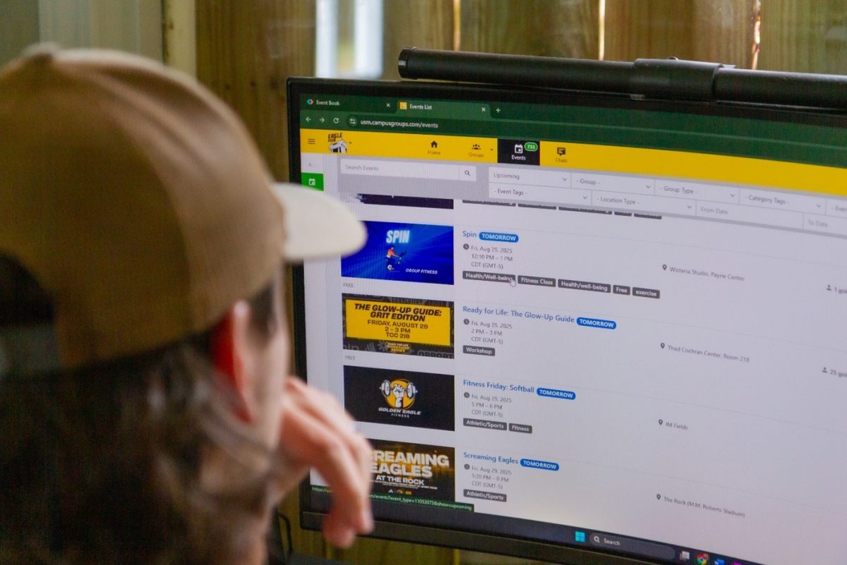 A USM student staff member works on organizing a campus event.