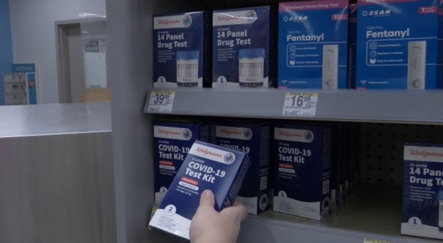 COVID-19 test kits at a local pharmacy.