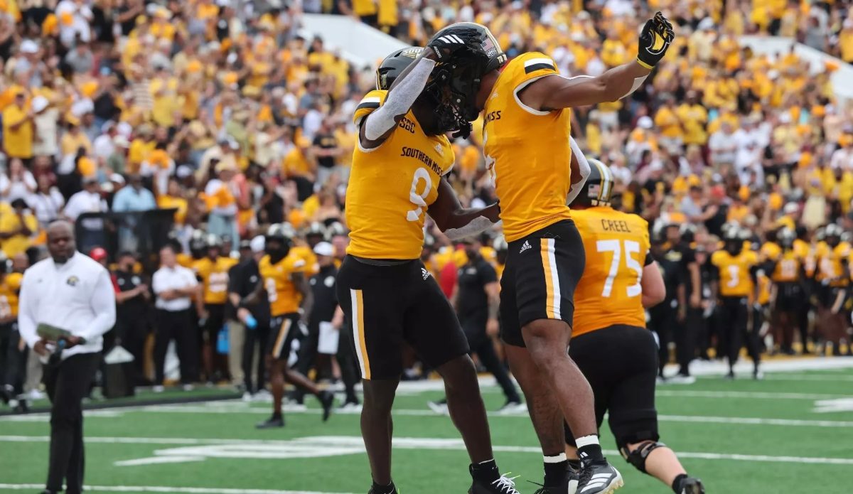 USM football players celebrate after scoring a touchdown against Mississippi State University.