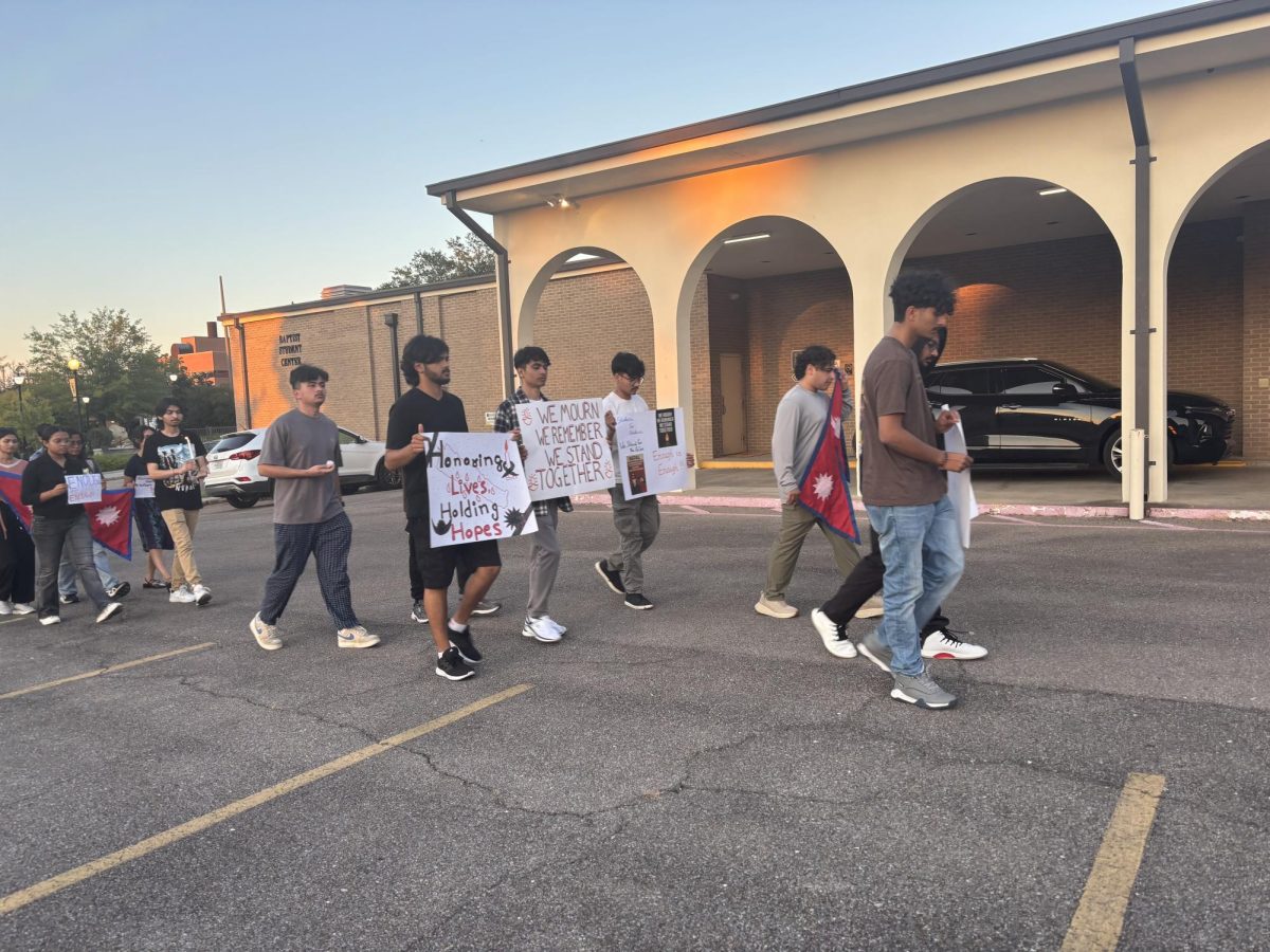 Students marching around the parking lot in solidarity of those who lost their lives.