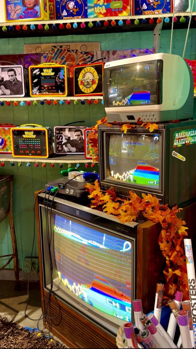 Vintage video game consoles and televisions displayed at The Lucky Rabbit.