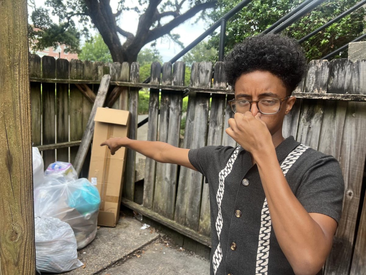 USM student Hilawe Tibebe, points out trash at Hattiesburg Hall.