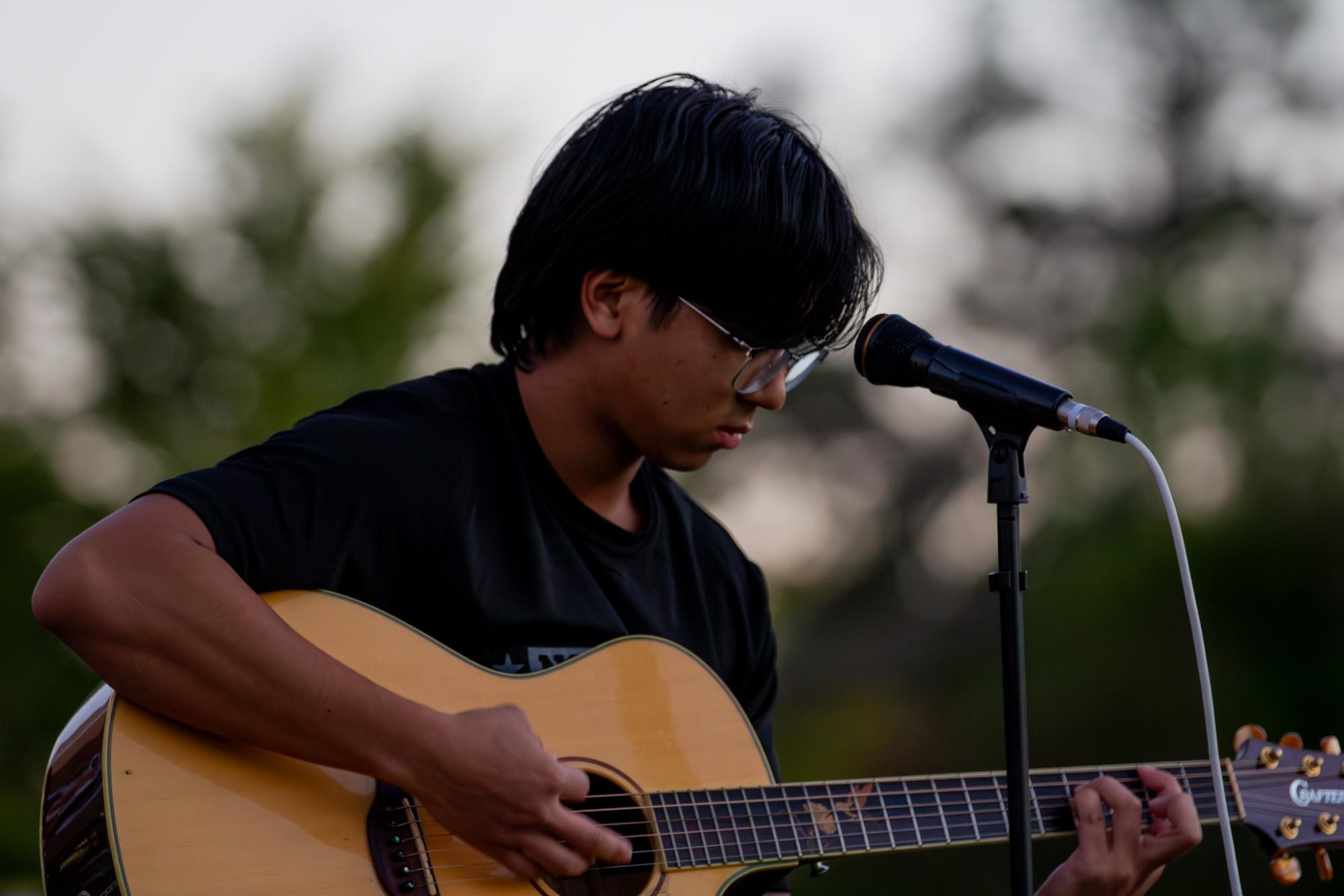 Student performing at the Live Music Club.