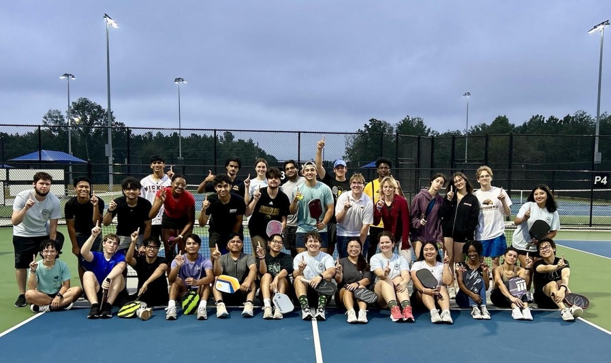 Golden Eagle Pickleball Club gathers following a successful evening of games.