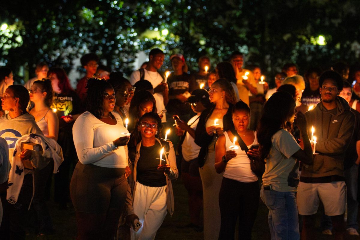 USM students pay tribute to Trey Reed during a recent candlelight vigil on campus.
