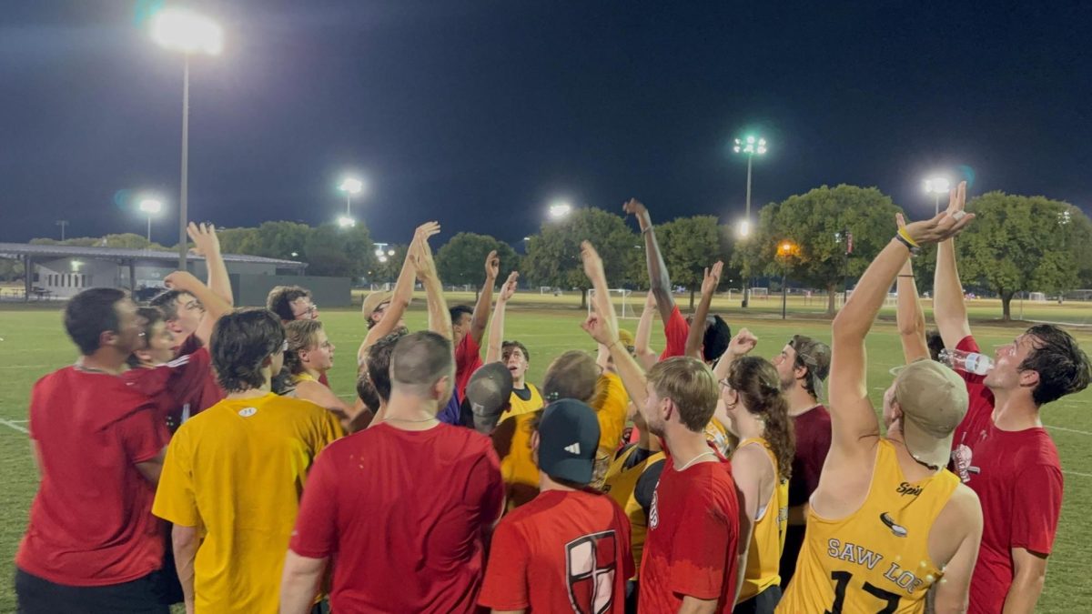 USM's Ultimate Frisbee team breaks the huddle with William Carey following a scrimmage between the two schools.