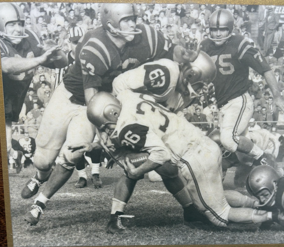 Richard Johnston (#52) makes a tackle against a Chattanooga ball carrier in the 1958 UPI National Championship Game. 