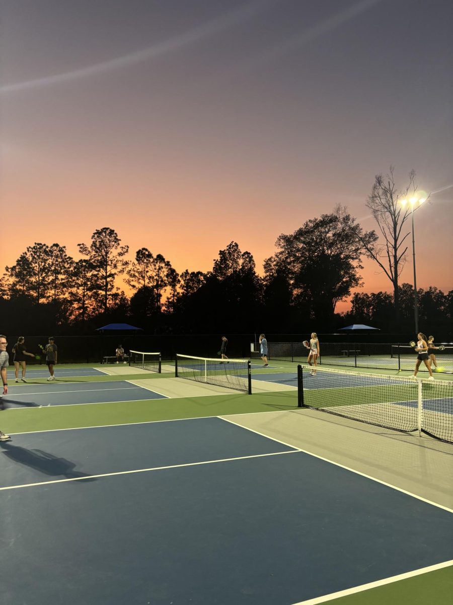 Students playing at the Lamar Tennis and Pickleball Courts. 