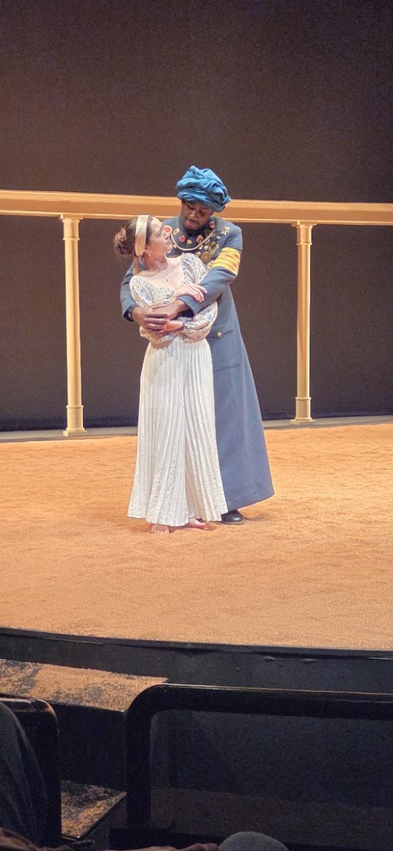 D'Kameron Edmonson as Othello and Charlotte Archey as Desdemona embracing each other in the "Othello" play in the Tatum Theatre on Feb 26. 