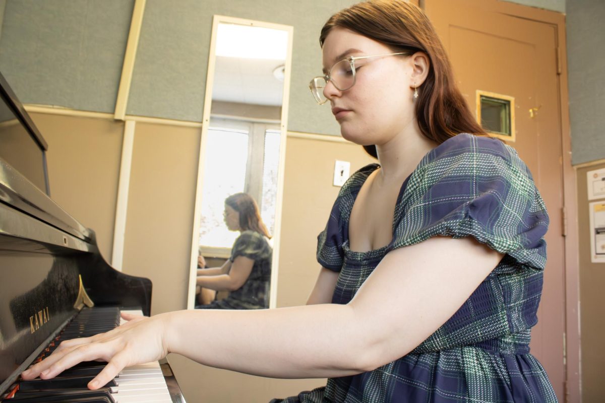 Bonnie Littlejohn playing the piano in the music building on USM campus. 