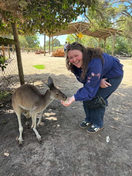 Cloè Knight feeds a Kangaro while completing her student teaching abroad in Australia.