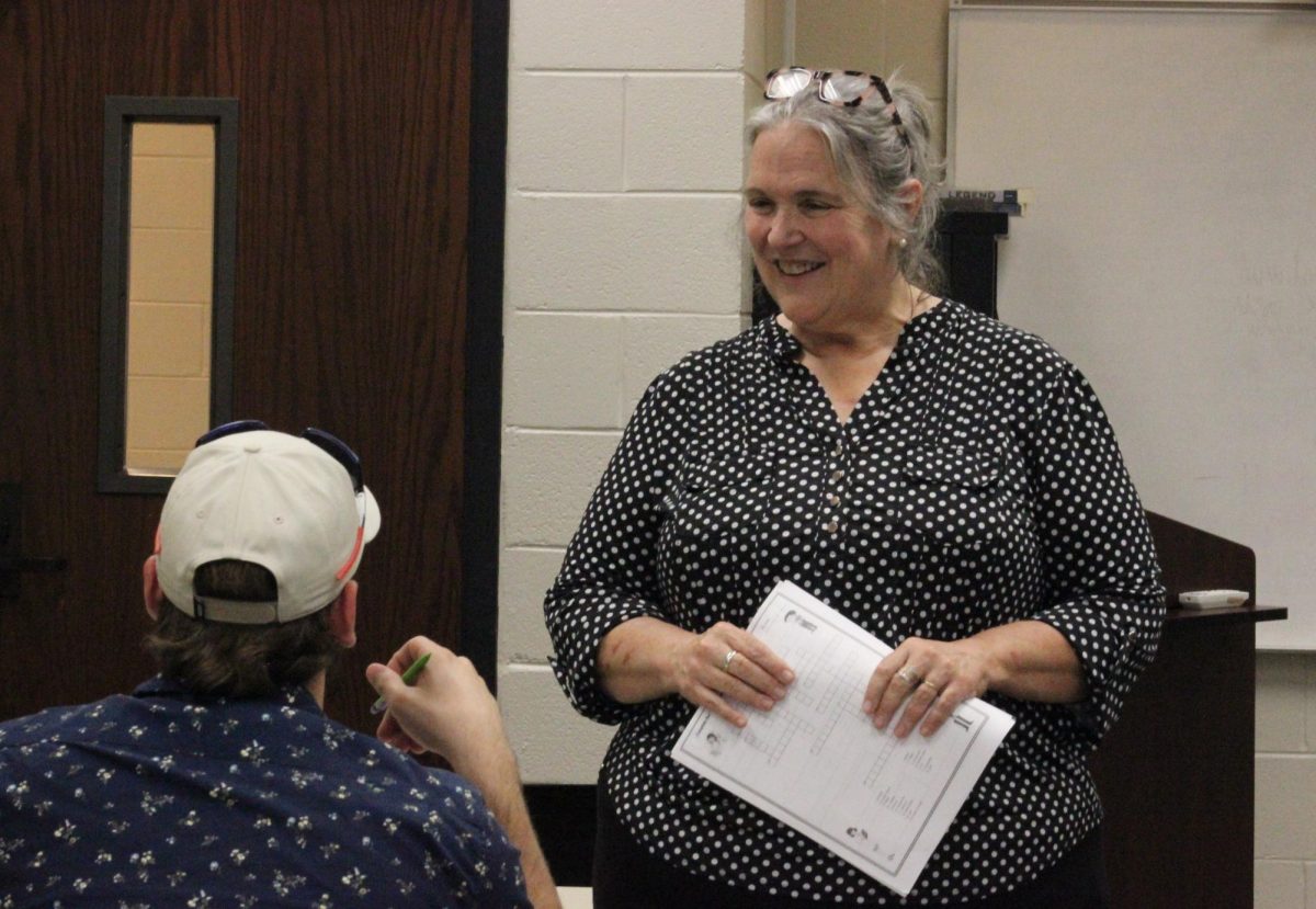 Spanish professor jeanne gillespie engages with a student during class, fostering an interactive learning environment that encourages cultural connection.